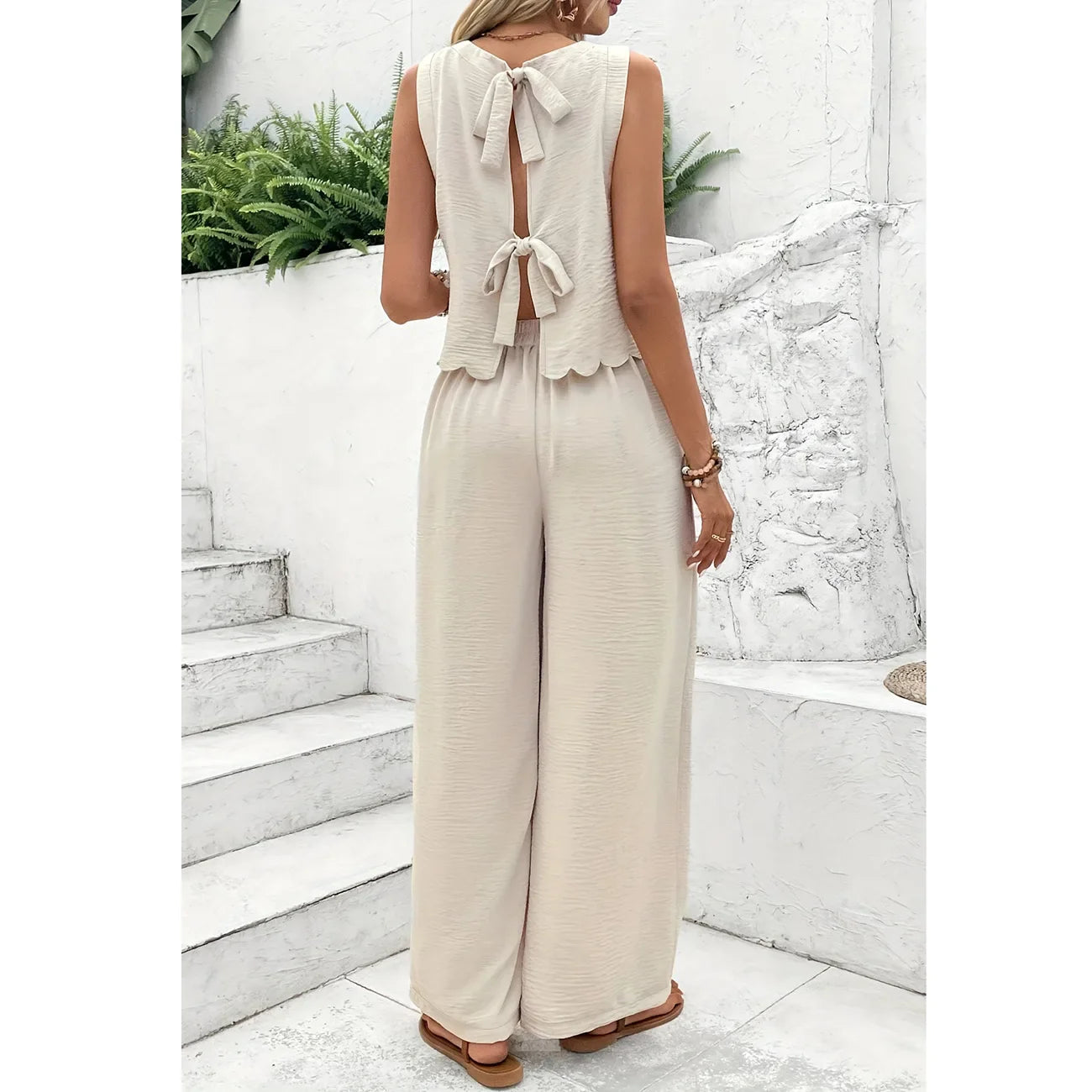Casual set, wide pants, sleeveless blouse, open back with tie, detail on the hem of the blouse