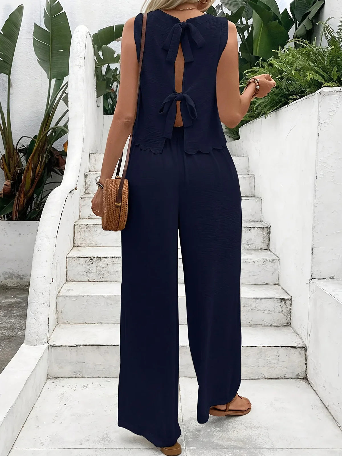 Casual set, wide pants, sleeveless blouse, open back with tie, detail on the hem of the blouse